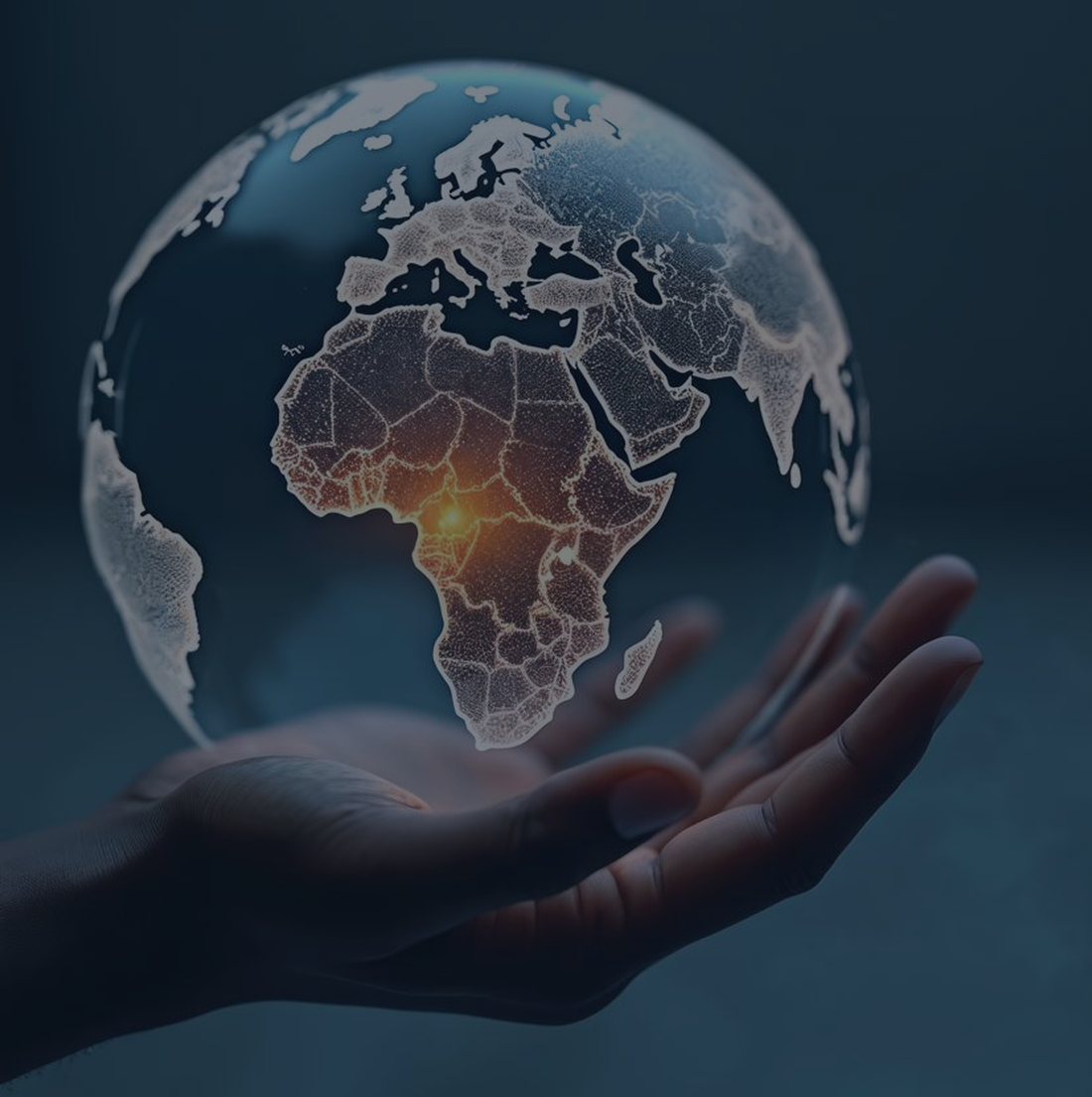 Une main tenant un globe terrestre, l'Afrique centrale éclairée